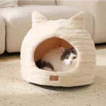 una cuccia calda da grotta per gatti